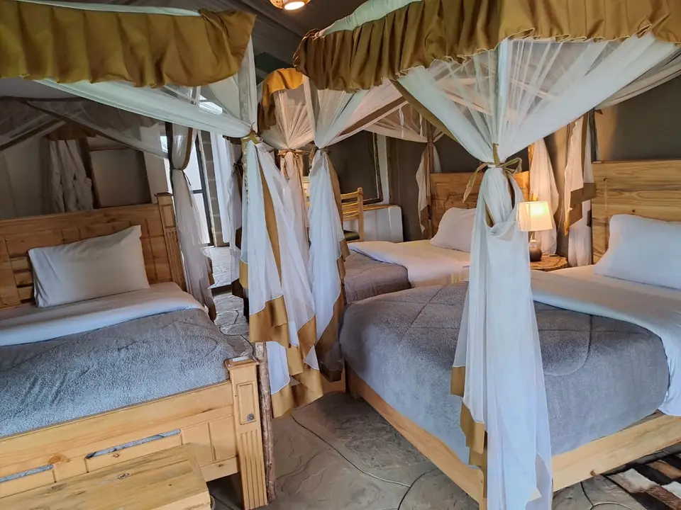 Spacious family tent with several canopy beds